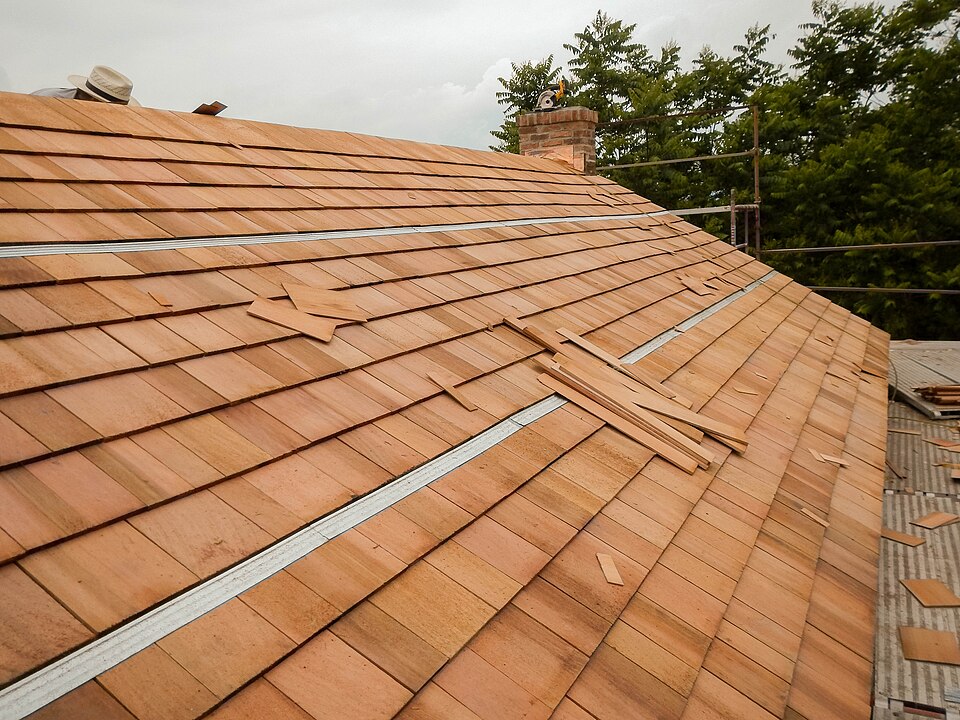 Work on a cedar shingle roof